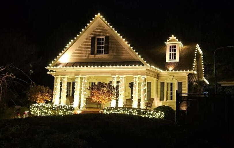 Cottage porch Cottage with wrapped porch columns and roofline Christmas lights